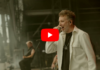 Sidilarsen dévoile « Intox – Live au Hellfest » Le chanteur de Sidilarsen au micro sur scène, veste blanche et collier, lors d'une prestation en plein air
