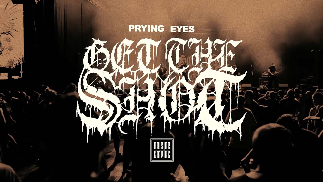 Visuel du titre Prying Eyes de Get The Shot avec le logo du groupe sur fond de foule en concert