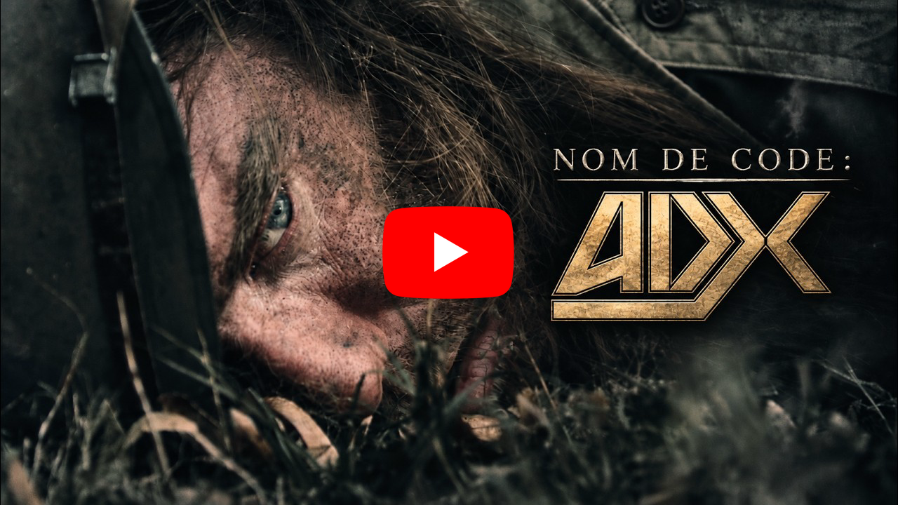 Visuel du clip « Nom de code : ADX » montrant le visage d'un homme à moitié couché dans l'herbe, avec le logo ADX et le bouton lecture